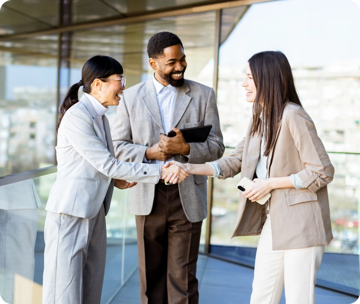 Businesspeople shaking hands outdoors